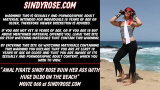 Anal pirate Sindy Rose ruin her ass with a huge anal dildo on the beach
